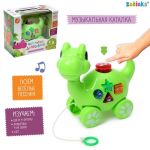 Каталка на веревочке Динозаврик 1+ музыкальная 5221837